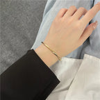 Brazalete Abierto Trenzado Dorado