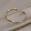 Brazalete Abierto Trenzado Dorado