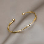 Brazalete Abierto Trenzado Dorado